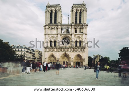Notre Dame de Paris. France. Ancient catholic cathedral on the quay of a river Seine. Famous touristic architecture landmark in summer. Toned