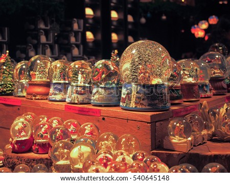 Snow globes for Christmas gifts in Christmas market with selective focus