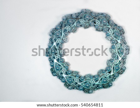 Oval blue photo frame with pearls on white background