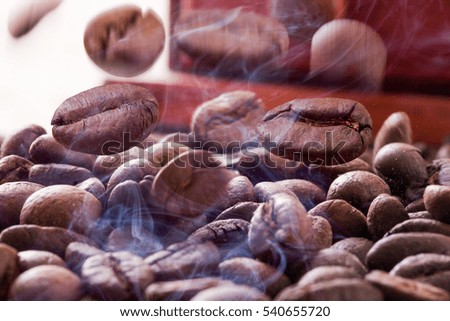 Coffee beans while roasting hot splashes