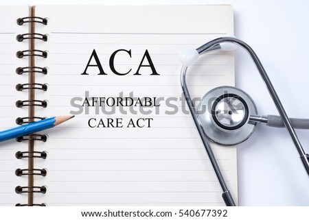 Notebook and pencil with ACA (Affordable Care Act) on the table with stethoscope, medical concept