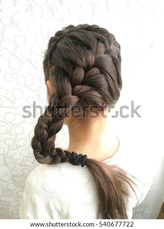 spikelets long hair braiding Royalty-Free Stock Photo #540677722