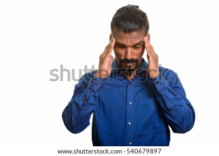 Young Indian businessman having headache isolated against white background