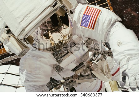 Astronaut in the open space. "The elements of this image furnished by NASA"