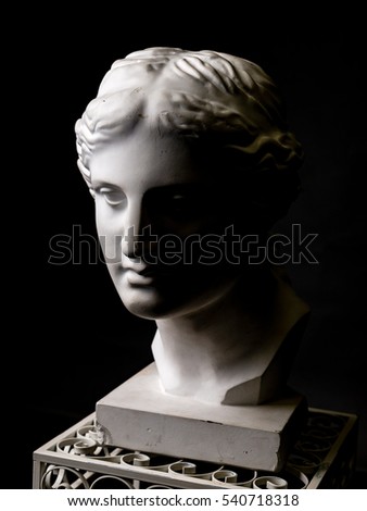 white clay head silhouette on black background