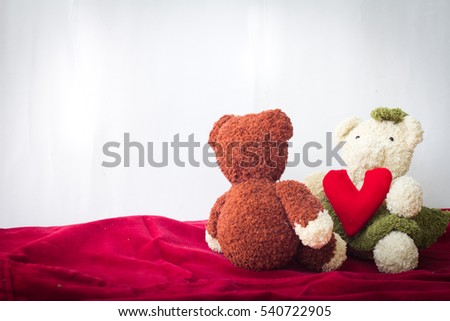 Bear and a heart shaped with white wall background