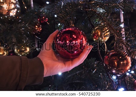 christmas decoration in hand with bokeh Royalty-Free Stock Photo #540725230