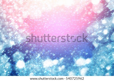 Christmas round blue bokeh or glitter lights on serenity background.Abstract circle defocused particles and rays