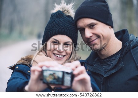 Young couple taking self portrait outdoor