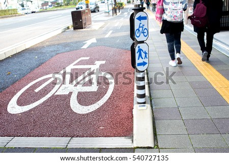 Pedestrians walk lane and bicycle path ride