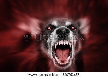 Red glowing eyed dog-like aggressive demonic attacking beast, incarnation of evil, fear and hereafter. Blurred for reason to emphasize movement. Royalty-Free Stock Photo #540753655