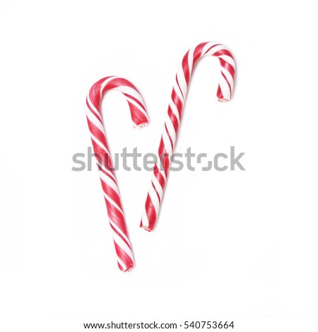 Pair of red Christmas candy can isolated on white background