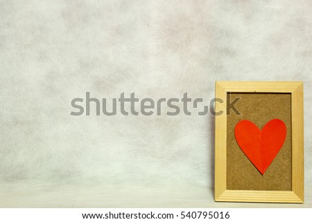 the heart picture in frame on background gray