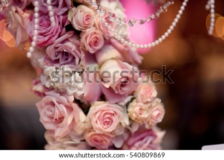 Closeup of pink roses put over the candleholder