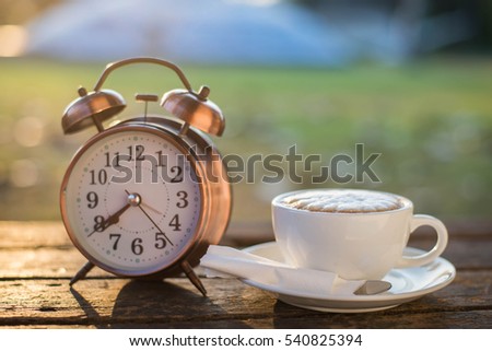 cup of coffee on rustic wooden table 