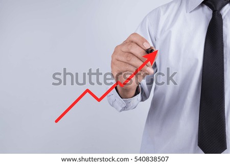 Businessman hand drawing a chart show
