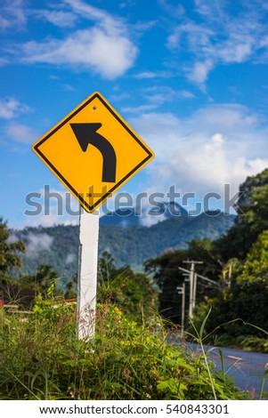 The Road sign left curve in Thailand