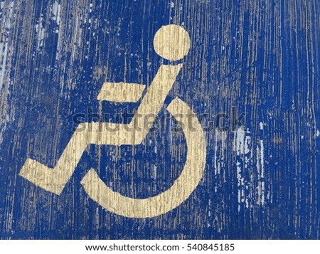 disability symbol on blue cement background