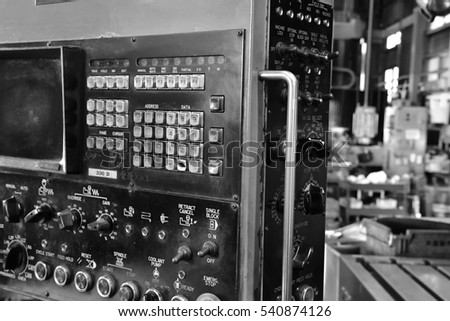 Milling machine. Machine control panel. Black-and-white photo.