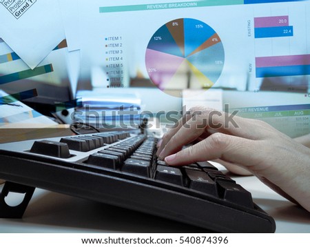 Women hand typing on the keyboard with business chart background. showing data analytic concept.