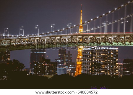 Night view Rainbow Bridge and Tokyo tower.Tokyo City Skyline background from Tokyo bay, Odaiba, Japan