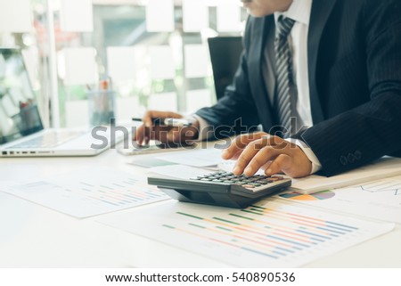 businessman working plan the business and analysis many chart graph.
Film effected photo.