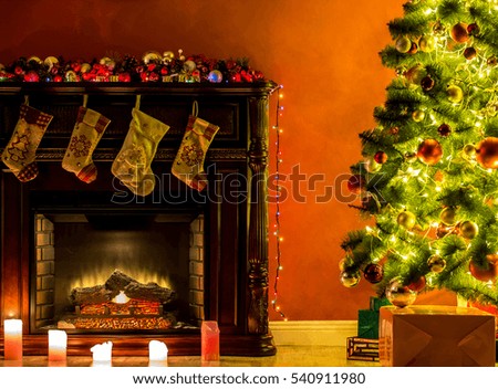 Beautiful Christmas living room with decorated Christmas tree, gifts and fireplace with the glowing lights at night