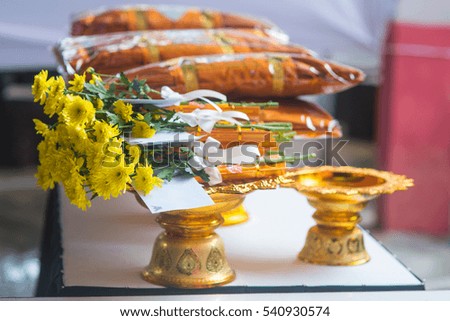 The Buddhist Way: Food and flower in a basket for giving to monk.
