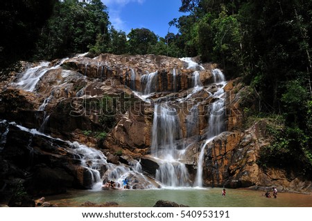 Scenery of Sungai Pandan Water Fall. Sungai Pandan Waterfall located 25 km from Kuantan town at Felda Panching Selatan Pahang. soft focus, a slow shutter picture with soft water flow.