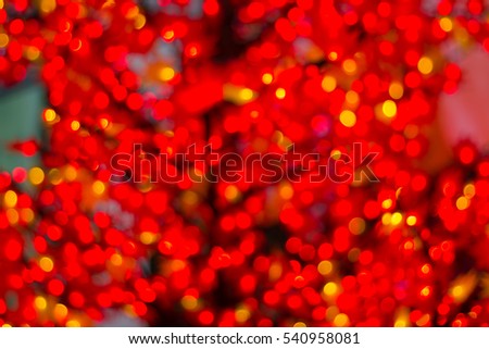 light bokeh  and  blurred background of string light   hanging on tree in the garden at night time - decorative christmas lights - happy new year
