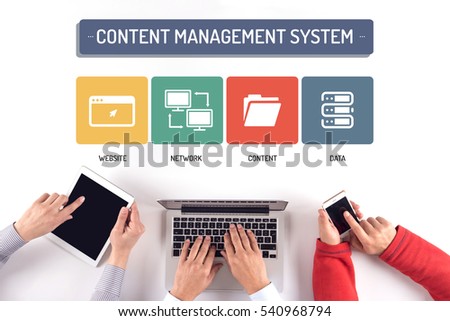BUSINESS TEAM WORKING ON CONTENT MANAGEMENT SYSTEM CONCEPT