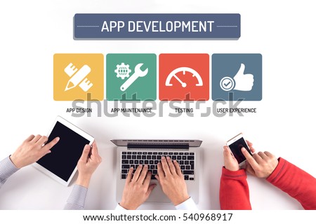 BUSINESS TEAM WORKING ON APP DEVELOPMENT CONCEPT Royalty-Free Stock Photo #540968917
