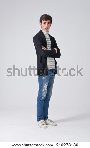 Full body young man Casual standing on gray background