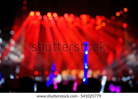 Defocused entertainment concert lighting on stage, blurred disco party. red color.