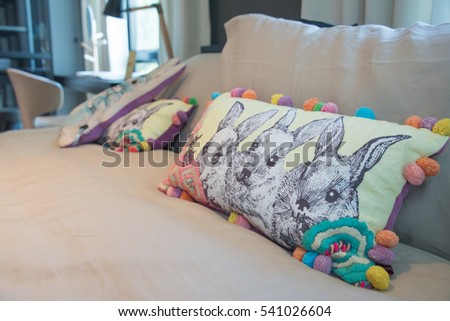 Cartoon pillow on a bed, kid room
