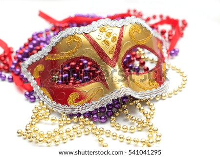 mardi gras mask and beads for party