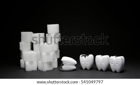 Heap of a lot of cubes sugar and Decayed tooth 