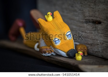 wooden toy of yellow jackal story