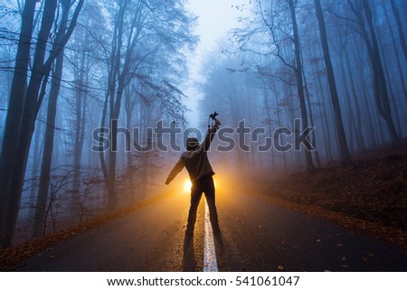 a man with light in the forest