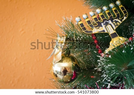 Jewish menorah on a Christmas (New Year) tree. In December 2016 Jewish holiday Hanukkah coincides with Christmas and New Year. 