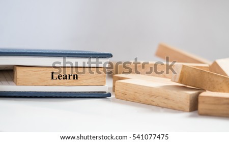 Learn word written on wood block