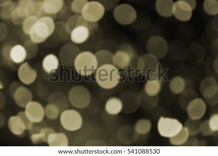 Explosion of pale yellow lights, out of focus