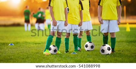 Boys Training Soccer. Children Playing Football in a Stadium. Soccer Players Team. Football Training for Kids