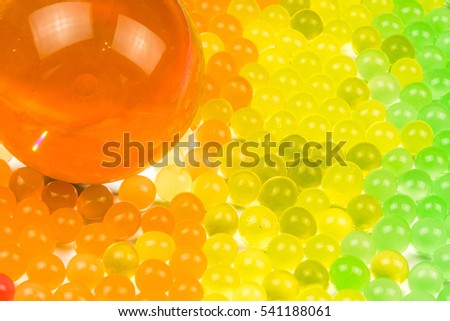 Glass ball and bubbles / Colorful polka dots sweet jell candy isolated on seamless background / celebration funny gelatin transparent water balls for party day texture / rainbow gradient