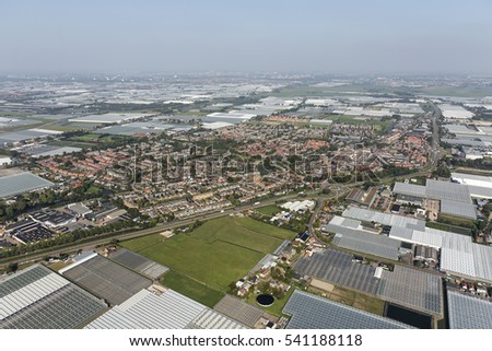 Aerial view of village De Lier, surrounded by greenhouses in Westland, an area with thousands of glass houses near The Hague, in the province of Zuid-Holland, Netherlands. 