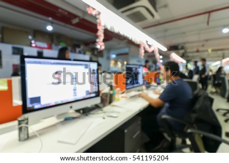 office blur background with worker and computer