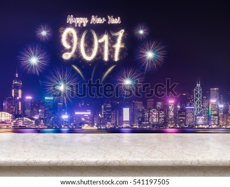 Happy new year 2017 fireworks over cityscape at night with empty cream marble table,Mock up template for display or montage of product for social media advertising Royalty-Free Stock Photo #541197505