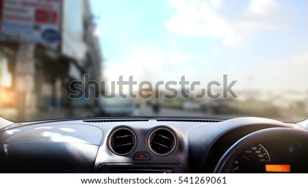 car dashboard in front of village. Royalty-Free Stock Photo #541269061