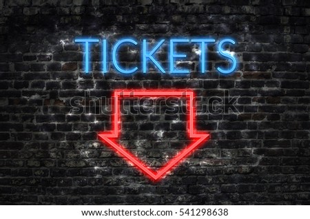 Tickets neon sign on dark brick wall background
