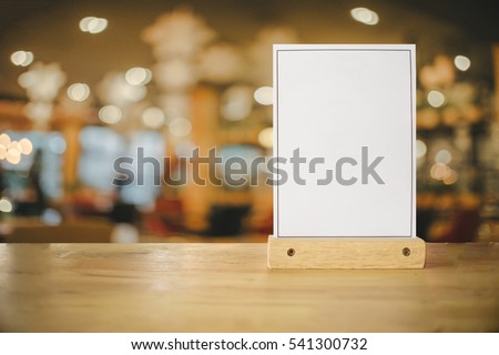 White label on the table. Stand for acrylic tent card Used for Menu Bar and restaurant or put everything into it . mockup  Royalty-Free Stock Photo #541300732